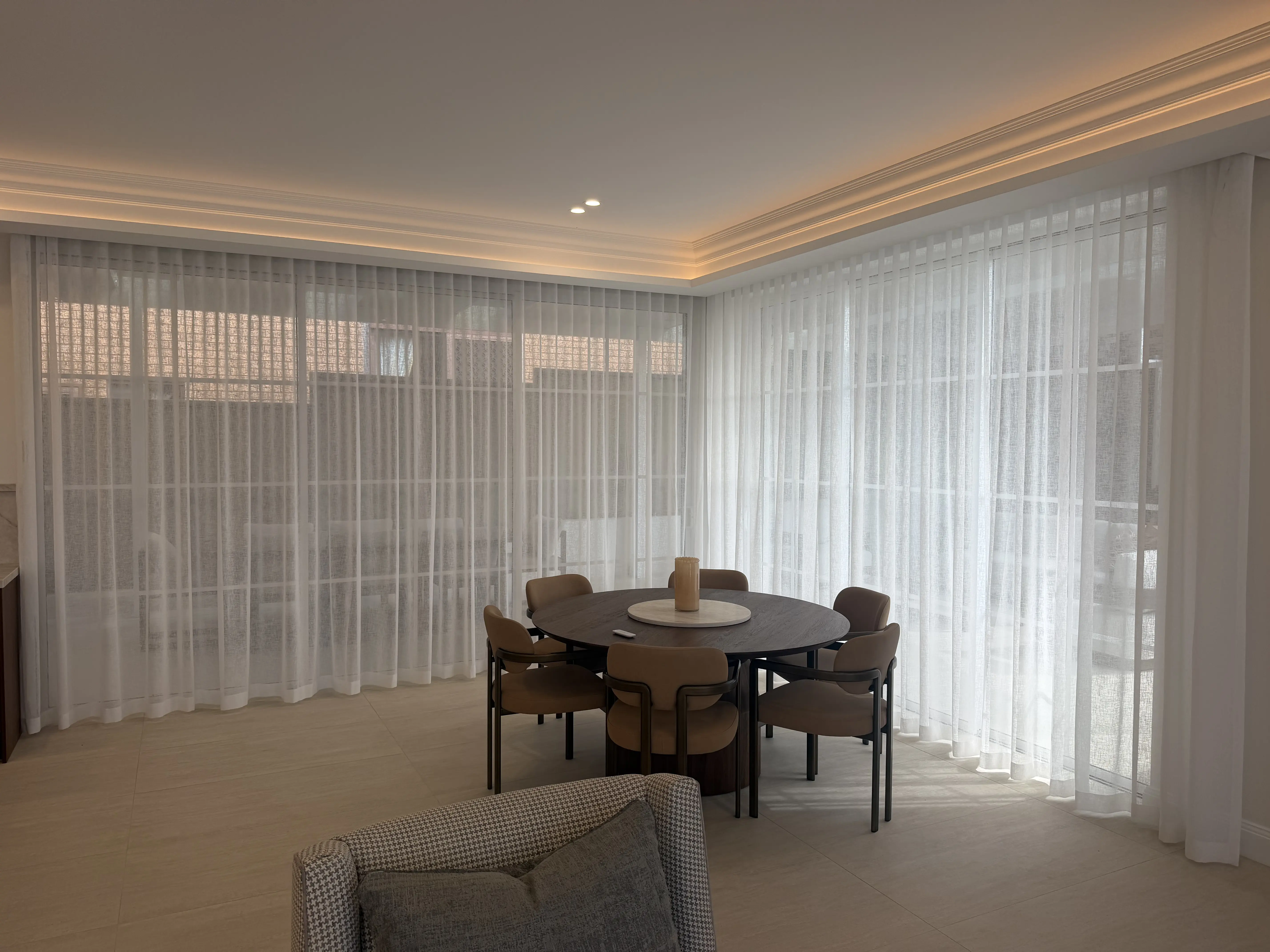 Layered sheer and blockout curtains in a Sydney home