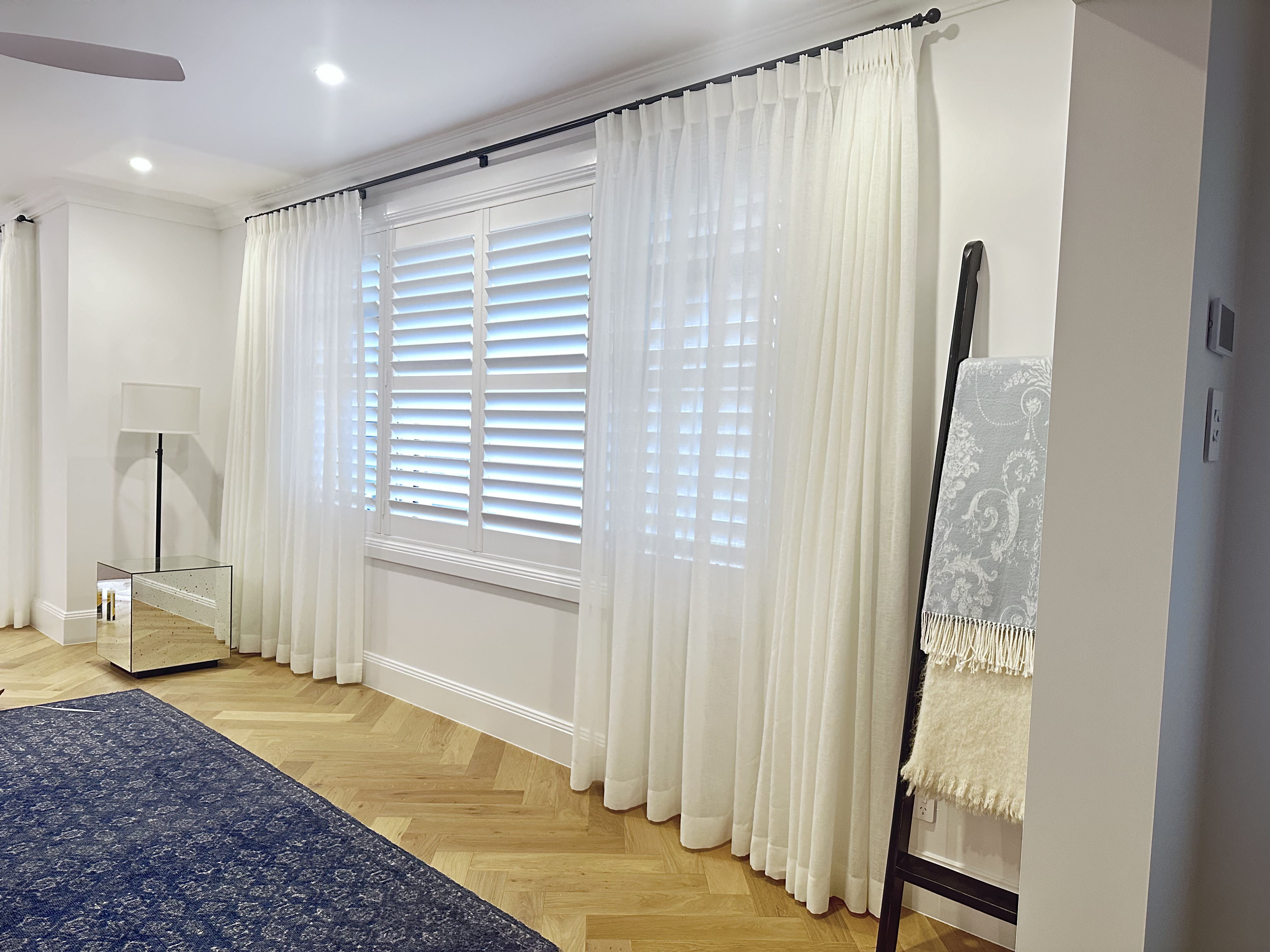Elegant dining area with sheer S-fold curtains